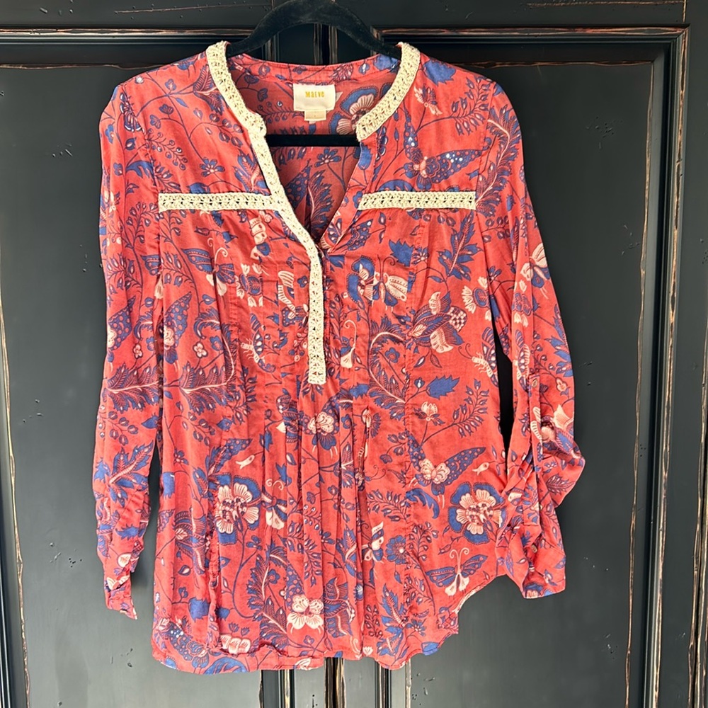 Flowers and Butterflies flow in this sweet patterned blouse.